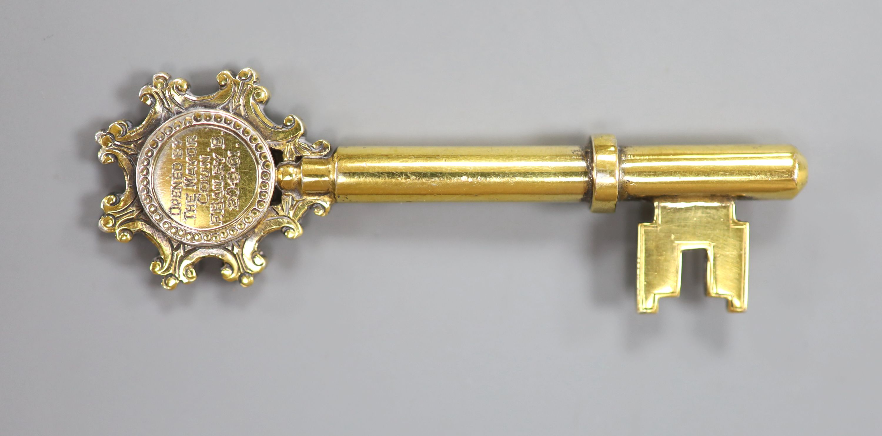 A modern silver gilt presentation key, Birmingham, 1961, 67mm, with engraved inscription.